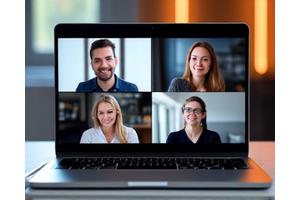 A diverse group of people engaged in a video call on a laptop, symbolizing remote consultation.